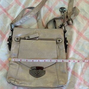 Metallic silver Mia DeLuca crossbody bag.